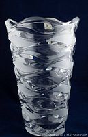Full view of the clear crystal vase showing wavy textured design and sculpted rim with JG Durand label.