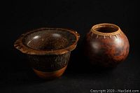 Two items displayed together on a black background: a wooden bowl with live edge and a clay pot planter.