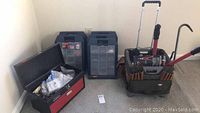 Photo showing Homak two-drawer red and black metal toolbox, Rubber Maid bins, and BucketBoss rolling toolbox with telescoping handle, all containing tools and hardware