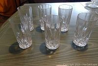 Six clear lead crystal tumblers displayed on a table, showing the height and cut crystal bases.