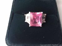 Front view of sterling silver ring with large square pink gemstone.