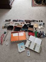 Full overview showing eyewear, glasses cases, stationery, notebooks, and card boxes