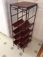 Overall angled view of metal and wooden wine bottle rack on vinyl flooring