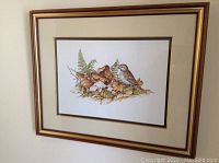 Full view of framed print showing the sparrow on mushrooms and leaves artwork in a gold frame.