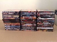 Front view of all DVD cases arranged in three rows showing all movie titles in the lot.