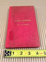 Photo of the book cover with red cloth binding and gold embossed title 'Salmon Fisheries of the St. Lawrence'.