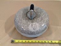 Top view showing overall shape and measurement tape across diameter