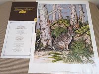 Full view of the signed rabbit print alongside Certificate of Authenticity and folder.