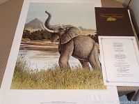 Full view of the elephant print with Certificate of Authenticity and artist folder visible