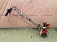 Full side view of Mantis rototiller showing handles, engine and tines