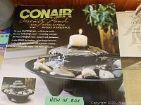 Conair Serenity Pond new in box showing mood candle and rock formations