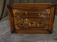 Wooden serving tray with detailed mother of pearl inlay showing chariot pulled by horses and decorated corners.