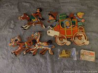 Five vintage wall cutouts featuring cartoonish horses, stagecoach and passengers from 1958 by The Dolly Toy Co.