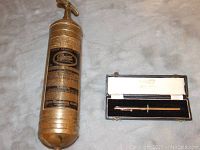 Photo showing Pyrene Heavy Vehicle fire extinguisher and paint depth gauge in case.