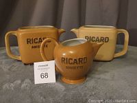 Three Picard pitchers displayed with visible brand markings and a MaxSold tag