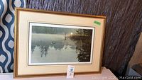 Full view of framed print showing loon on lake scene