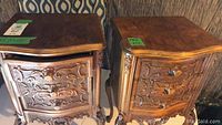 Two end tables side by side showing overall carved design and finish