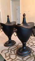 Front quarter view of both urns side by side on tabletop
