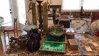 Overview of lot items on countertop, showing candlesticks, vases, coffee carafes, glass bowls, decorative plate, coral sculpture, and serving tray.