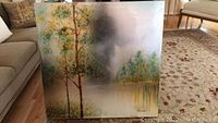 Front view of large 40x40 stretched canvas painting with trees and pond landscape, signed bottom right.