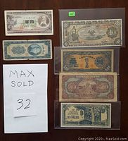 Top and bottom view of various Japanese, Chinese and Mexican bank notes showing front and back sides