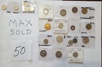 Wide layout showing 17 assorted transit tokens from various locations including TTC, Indianapolis, Lancaster PA, Edmonton, and others, many in protective plastic holders with handwritten notes.