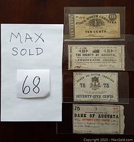 Front side of four obsolete bank notes including notes from North Carolina, Virginia, South Carolina, and Bank of Augusta, arranged vertically in plastic sleeves on a wooden surface.