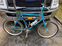 Full profile view of blue Norco mountain bike showing overall condition and components.