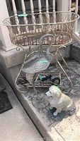 Overview of planter basket, crane sculpture, Labrador statue and garden light positioned together