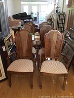 Six chairs arranged in room showing full set: four side chairs and two armchairs.