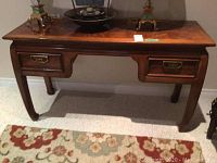 Full frontal view of the entire table showing tabletop, drawers and legs