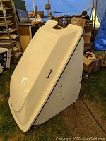 Left-side angled view of exterior showing overall shape and surface condition