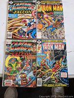 Four Bronze Age Marvel comic books including two Captain America & the Falcon and two Iron Man issues shown in a 2x2 layout.