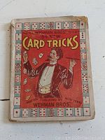 Front cover of the 84 New Card Tricks book showing a magician juggling playing cards, publisher Wehman Bros, price 10 cents.