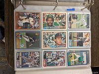 First image shows a binder open to a page with nine baseball cards including players Dave Henderson and Kirk McCaskill among others in full color.