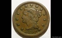 Obverse side of the 1847 Braided Hair Large Cent showing Lady Liberty's profile, dated 1847 with 13 stars surrounding.