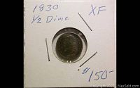 Young silver half dime coin from 1830 shown encased in card holder with handwritten date and grade XF, price $150 noted.