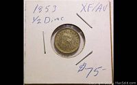 Coin secured in a cardboard holder marked '1853 1/2 Dime XF/AU $75-' showing the coin inside.