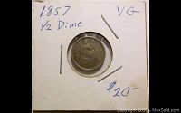 Front side of the 1857 Half Dime coin enclosed in a labeled flip with handwritten notes indicating date, denomination, condition 'VG', and a price of $20.