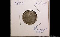 Front view of the 1835 Capped Bust Dime in holder showing the coin and handwritten grading (F/VF) and price indication.