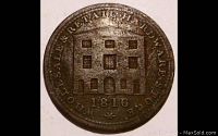 Obverse side of the 1816 token depicting a multi-storey building with windows and doors, with inscription around the edge.