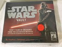 Front cover of 'The Star Wars Vault' showing book title, Darth Vader image, and author's names Stephen J. Sansweet and Peter Vilmur, sealed in original plastic wrap.