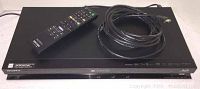 Sony Blu-ray player BDP-S570 with remote control and HDMI cable coiled on top of the unit.