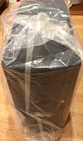 Black Antec Sonata PC tower case wrapped in original plastic covering.