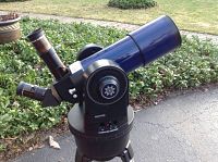 Telescope assembled on tripod with mount and eyepiece attached