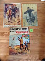 Photo of all three tin signs showing their full artwork and size