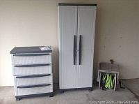 Both Black & Decker utility cabinets next to each other and Suncast hose wheel on the side.