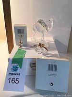 Overall view of all three crystal pieces on packaging box