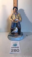 Front view of Royal Doulton 'The Seafarer' figurine standing 8.5 inches tall on a white surface with ruler in the background for scale.