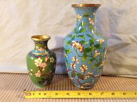 Both vases shown together with measuring tape indicating size